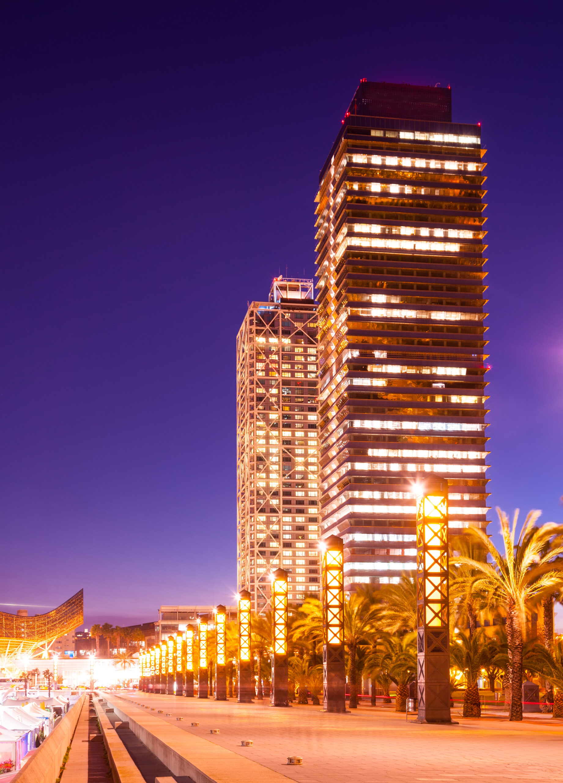 night view of skyscraper in Port Olimpic - center of nightlife at Barcelona, Spain